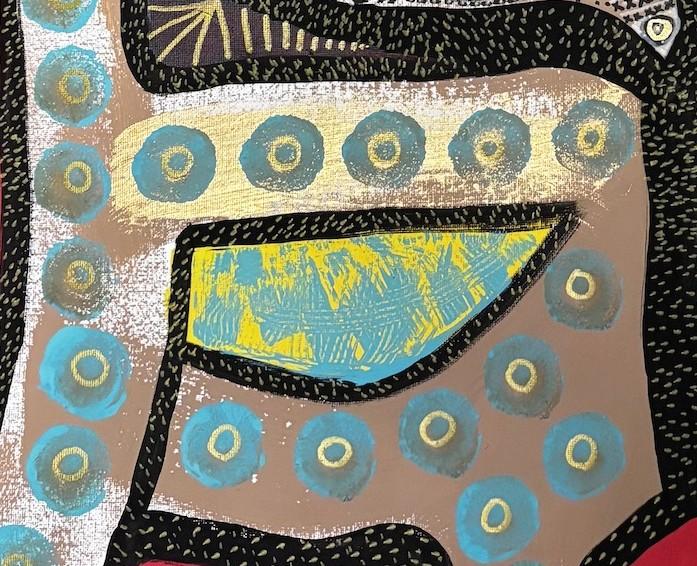 Close view of rows of turquoise dots, each with a small gold centre, painted over a clay-coloured field beside a stippled black line.